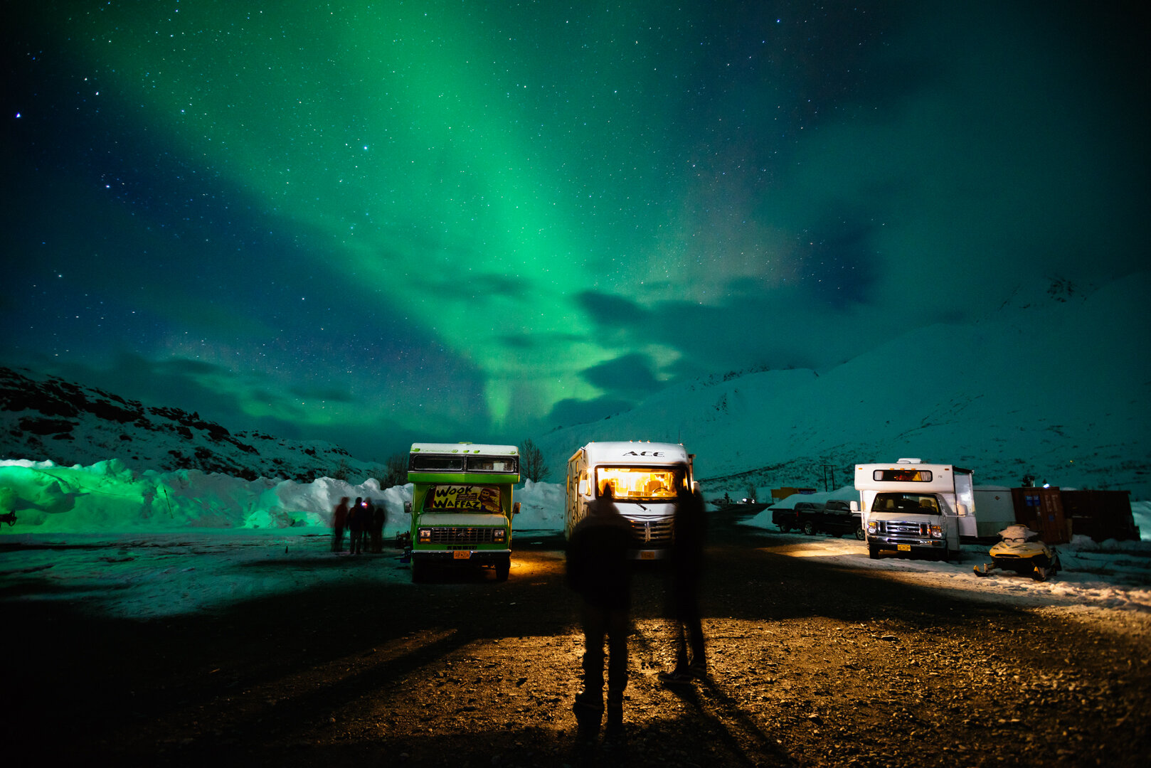 Northern lights over the motor homes parked at the ASG base on Thompson Pass
